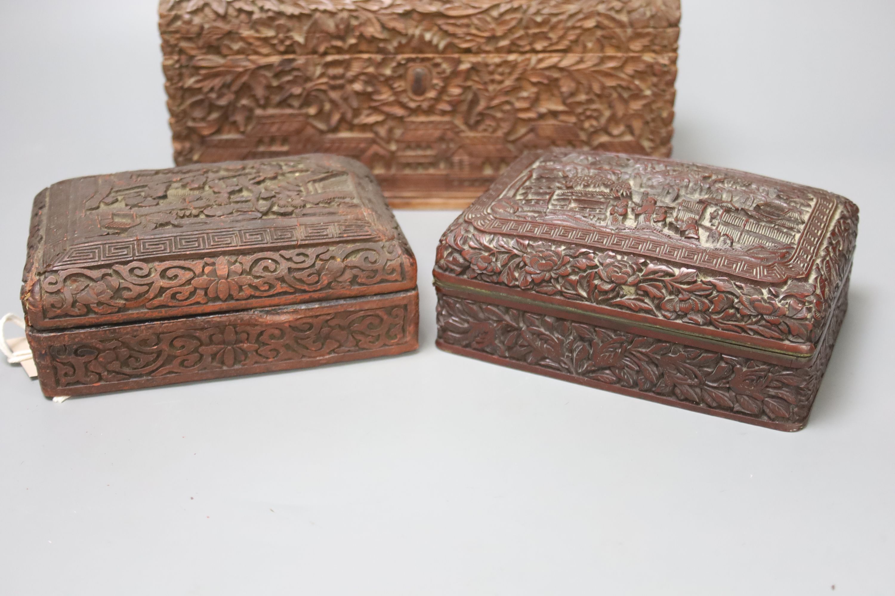 Four Chinese carved wood boxes, largest 24 x 12cm